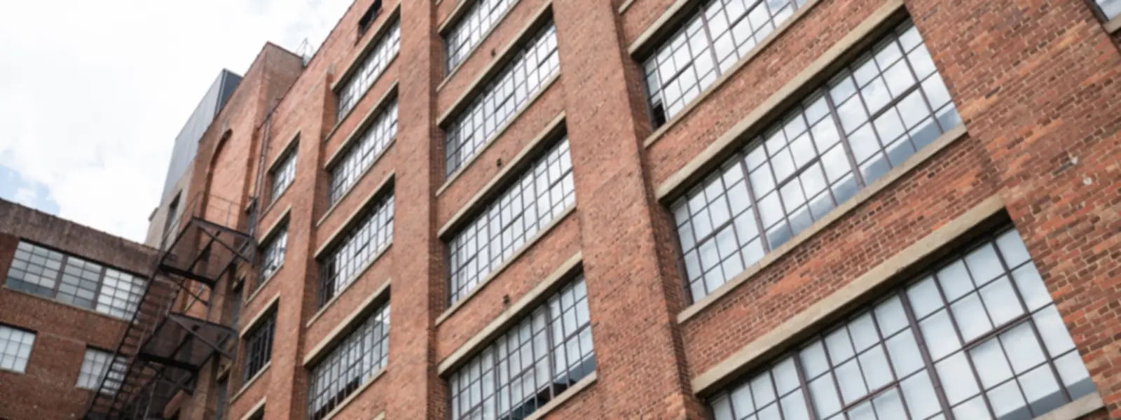 Brick apartment building with large windows