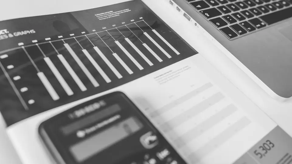 Calculator on top of printed financial charts