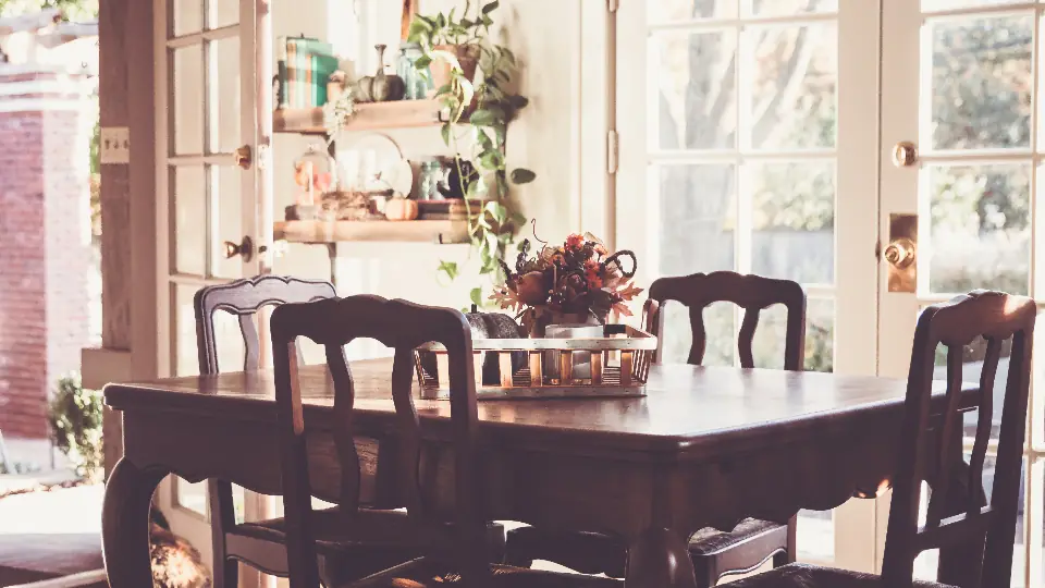 Furnished dining room with wooden table and chairs