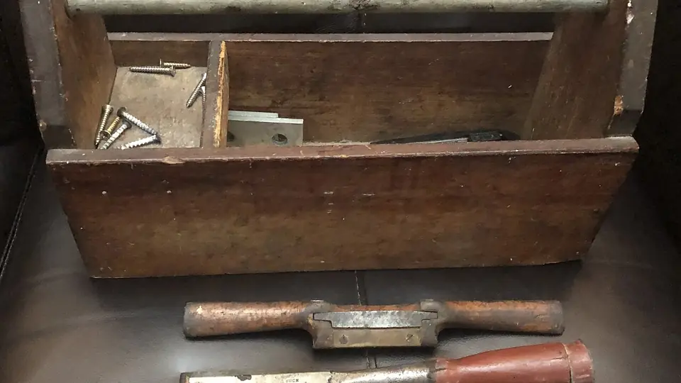 Old wooden toolbox with hand tools